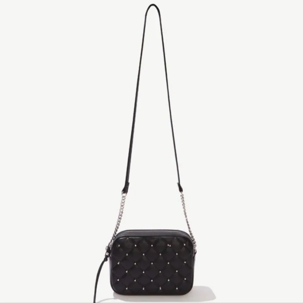 Rebecca Minkoff• Mini quilted studded black crossbody bag. 7.25” x 2.25” x 5.25”